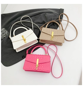 Detailed crocodile pattern bags in white, beige, and pink with elegant golden locks
