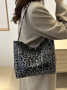 Stylish large capacity leopard print tote bag worn on shoulder for women in winter