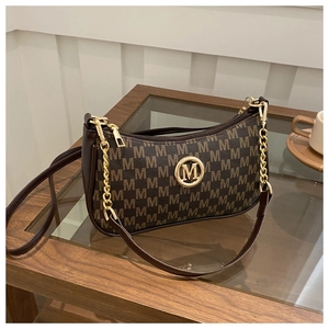 Detail of dark brown Hobo bag with M-print pattern and golden metallic logo clasp