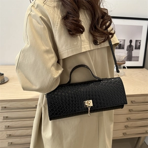 Chic black crocodile embossed baguette bag with gold chain and twist lock for women