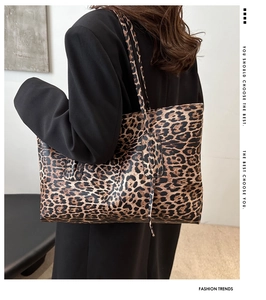 Detail view of large leopard print tote bag with long handles and PU leather finish