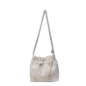 Chic beige bucket bag with bow accents and chain strap for women's crossbody wear