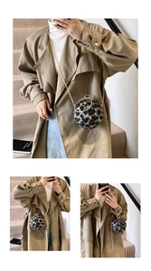 Detail of spherical faux fur leopard print bag with gold chain and round handle