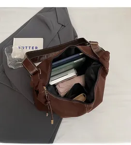 Deep brown matte tote bag showing high capacity interior with tablet and daily essentials