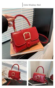 Macro detail of red patent leather handbag with gold buckle and smooth glossy finish