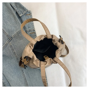 Top view showing the spacious interior and inner pocket of the khaki nylon tote bag