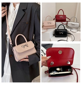 Detail view of mini bow bag showing interior capacity and colorful crossbody options
