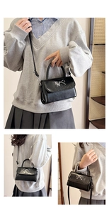 Close-up of black glossy mini square bag with silver metallic bow detail and strap