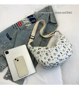 Size comparison of white cartoon dog crescent bag with a smartphone and iPad device