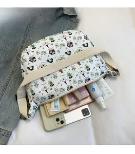 Detail view of white cartoon tote bag with large capacity for cosmetics and daily items