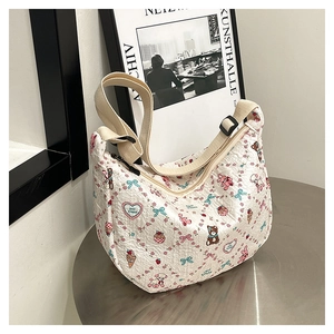 Detail of white seersucker crossbody bag with cute cartoon bear and bunny prints