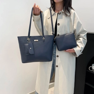 Navy blue faux leather tote bag set including a large shoulder bag and small pouches