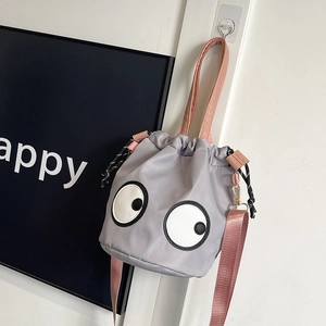 Grey nylon bucket bag with iconic eye pattern and adjustable pink shoulder strap