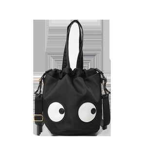 Funny nylon bucket bag with big eye design featuring top handle and adjustable strap