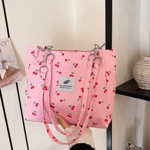 Pink tote bag with red cherry prints and stylish silver metal chain shoulder strap