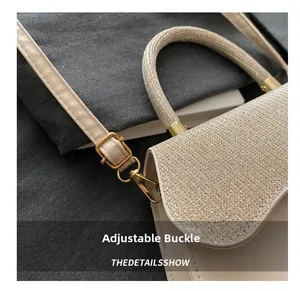 Detail of adjustable golden buckle and beige glitter strap on stylish crossbody bag