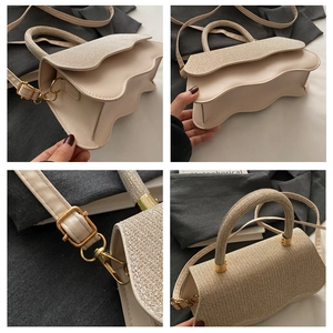 Detail view of beige crossbody bag with wavy edges, glitter texture, and gold hardware