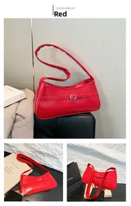 Detailed view of red retro baguette bag with horseshoe buckle and square metal buckle