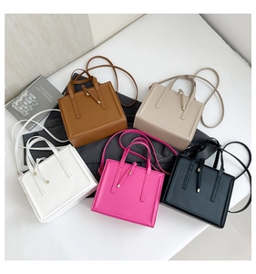 Top-down view of square minimalist handbags in brown beige white pink and black