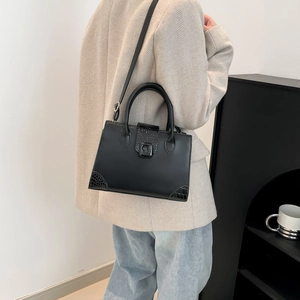 Chic black tote bag with crocodile pattern and adjustable strap for women in 2025 fashion