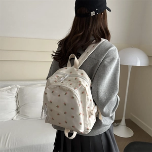 Minimalist floral backpack in beige with pink embroidery and zipper front pocket