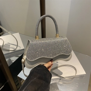 Elegant silver rhinestone crossbody handbag with wave flap design for formal party wear