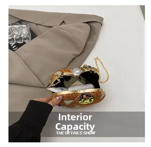 Internal view of a sequin evening bag showing space for lipstick and perfume bottles