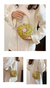 Detailed embroidery of yellow heart-shaped evening bag with beaded floral accents