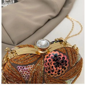 Macro detail of luxury evening clutch with colorful sequins and crystal buckle