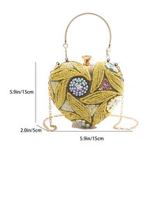 Sparkly heart-shaped sequin evening bag with green floral beadwork and gold ring handle