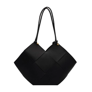 Minimalist large black woven leather tote bag with elegant thin shoulder straps
