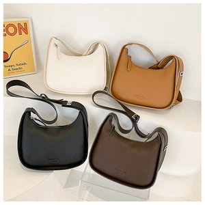 Selection of four chic minimalist hobo bags in off-white, caramel, black, and coffee
