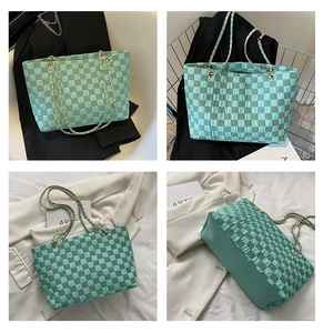 Detail view showing mint green checkered woven texture and golden chain handles of the tote bag