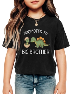 Close-up of black cotton t-shirt featuring cartoon dinosaur and Big Brother text