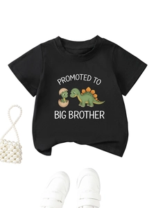 Close-up of black cotton kids t-shirt with dinosaur print and Big Brother text