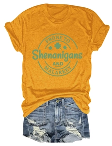 Close-up of yellow St. Patrick's Day t-shirt with green Shenanigans print and clover