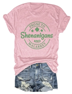 Flat lay of pink cotton t-shirt with slogan print and distressed blue denim shorts