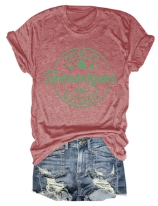 Detailed flat lay of red cotton t-shirt with green clover print and denim shorts