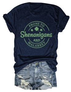 Detail of navy cotton T-shirt with clover print and distressed denim shorts