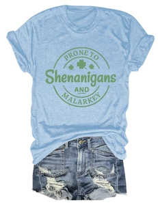 Detail of St. Patrick's Day graphic on light blue tee with distressed denim shorts