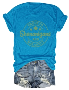 Flat lay of blue cotton T-shirt with Shenanigans text and frayed denim shorts