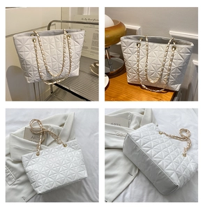 Detailed views of a white quilted tote bag with gold chain strap and geometric textures