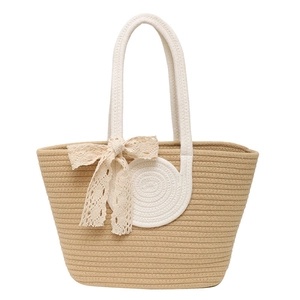 Large woven tote bag with white straps and cream lace bow detail for summer