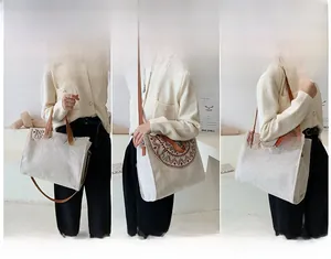 Three-way carry modes of canvas tote bag featuring ethnic embroidery and leather handles