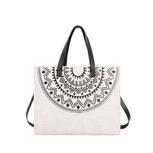Chic beige canvas tote bag with black mandala pattern and dual carry handles