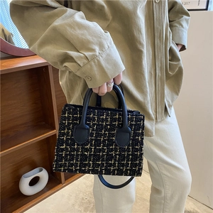 Chic black tweed handbag with gold thread weaving and leather handles for women