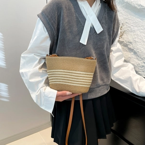 Classic striped woven crossbody bag with brown leather strap for summer beach vacation