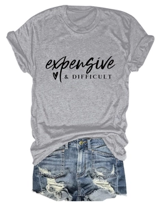 Detail of grey crewneck T-shirt with heart print and distressed denim shorts ensemble