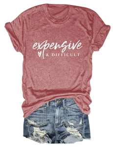 Detail of heather red T-shirt with white text and distressed denim shorts with fringe