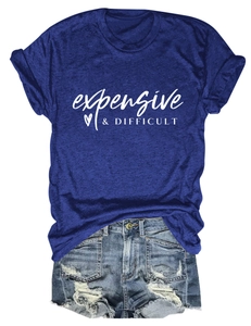 Detailed flat lay of a navy t-shirt with expensive & difficult print and ripped denim shorts